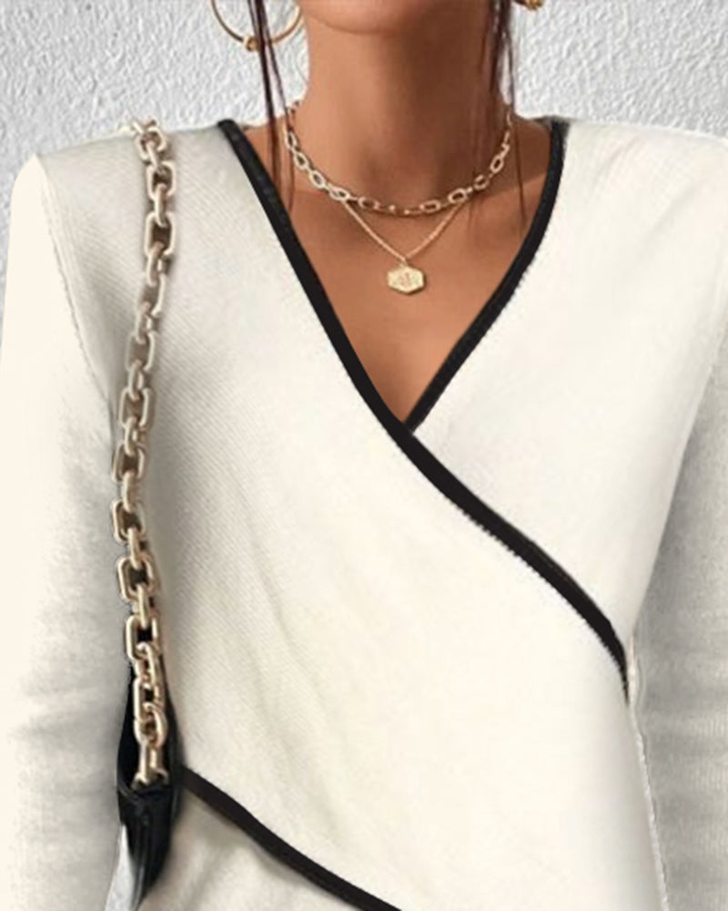 MAELYN – Elegante trui met wikkelstijl en contrastdetails
