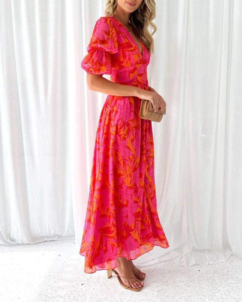 Maxi damesjurk in rood-roze tinten met zwierige pasvorm – Floriva Rouge